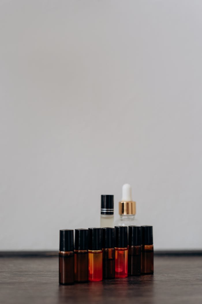 A minimalist arrangement of essential oil bottles showcasing beauty and aromatherapy products.