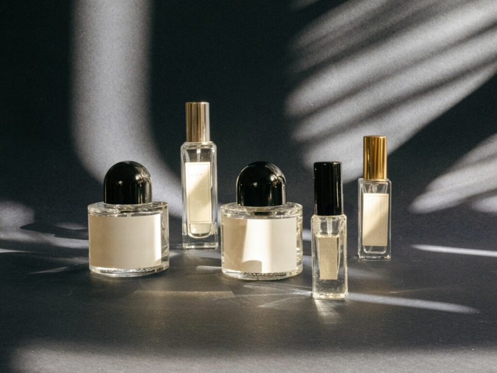 How to Layer Fragrance Oils: Rules and Combinations That Work A group of perfume bottles on a table